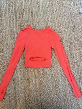 FP Movement by Free People Coral Orange Long-Sleeve Crop Top with Back Cutout